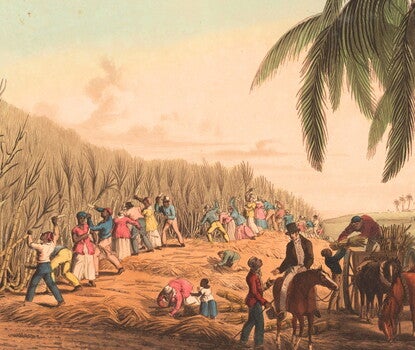 A hand-colored lithograph showing enslaved Black men and women cut sugar cane and load the bundles or junks into a horse-drawn cart. A White man on a horse speaks to a Black overseer. Includes cutting bills or knives, coconut palms, and a windmill in the distance.