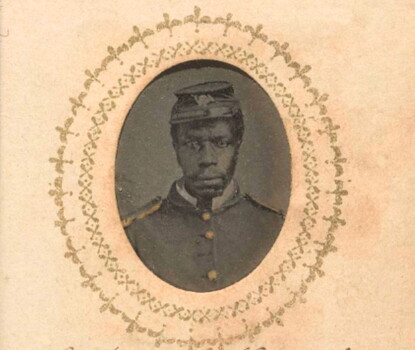 A photograph of a Black Civil War Union soldier in uniform in a rounded rectangular frame.